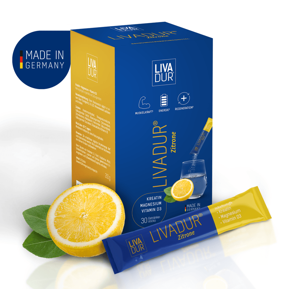 A box and sachet of LIVADUR® - Zitronengeschmack - 30 Tagessticks pro Packung are shown with a lemon slice, green leaves, and water. The packaging highlights Kreatin, Magnesium, Vitamin D3 for Muskelaufbau, plus a "Made in Germany" label.